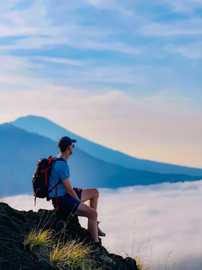 Hiker enjoying the panoramic view at Mount Batur in Bali
